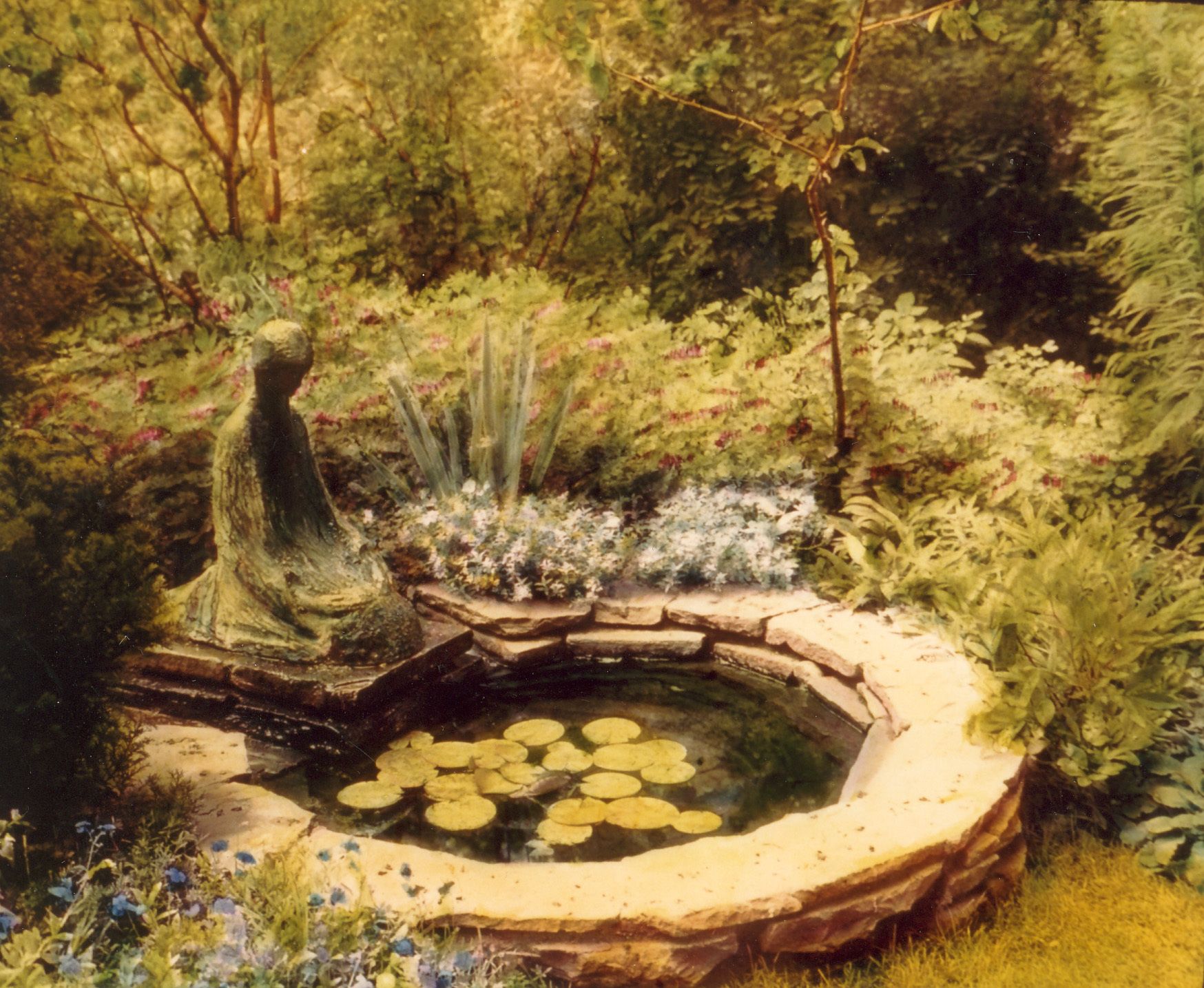 Small garden pond with “Kneeling Girl” statue by Alfeo Faggi at Covin Tree.