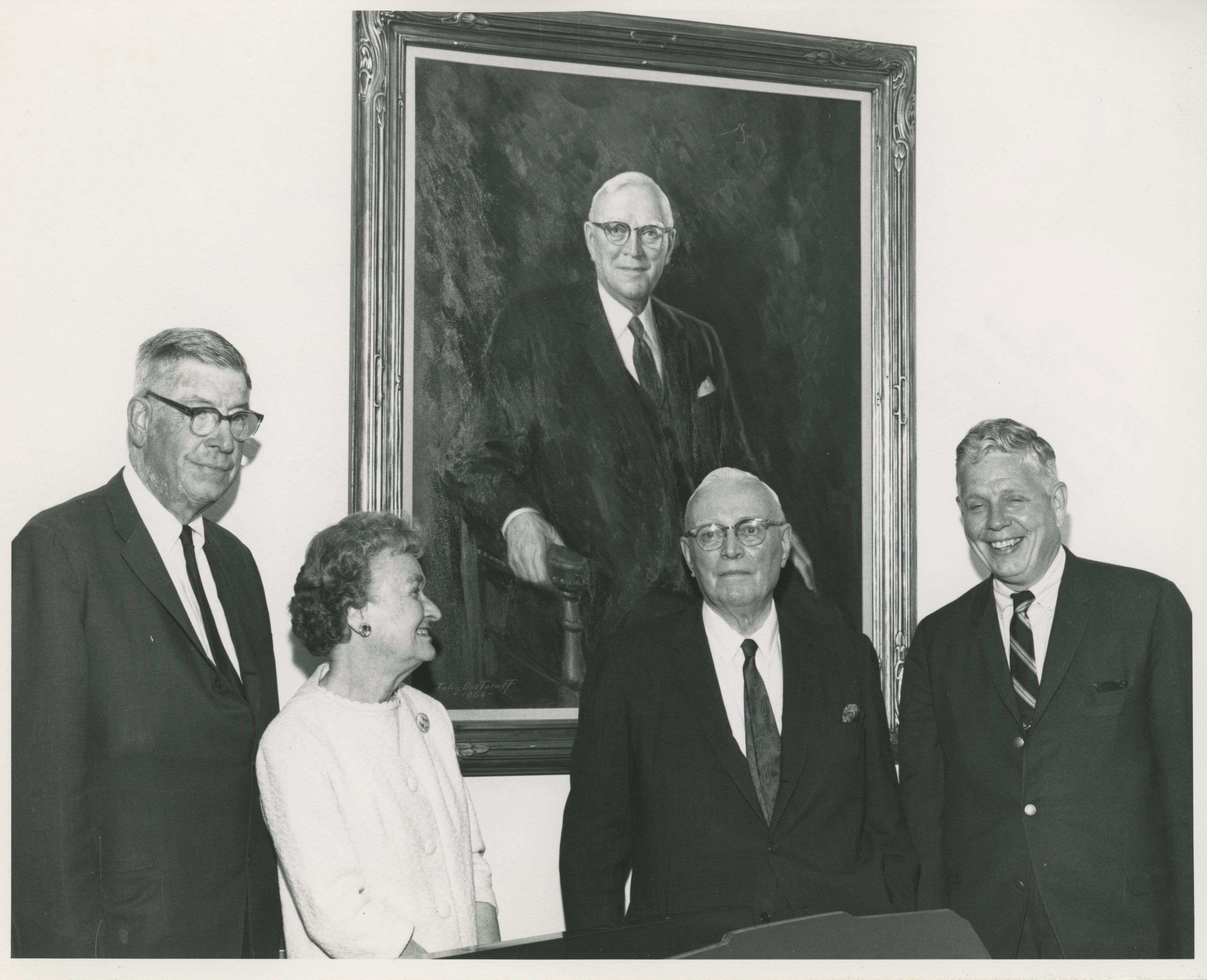 Joseph Fleming beneath his portrait at Lake Forest College. Image source: Lake Forest College Archives and Special Collections, Donnelley and Lee Library.