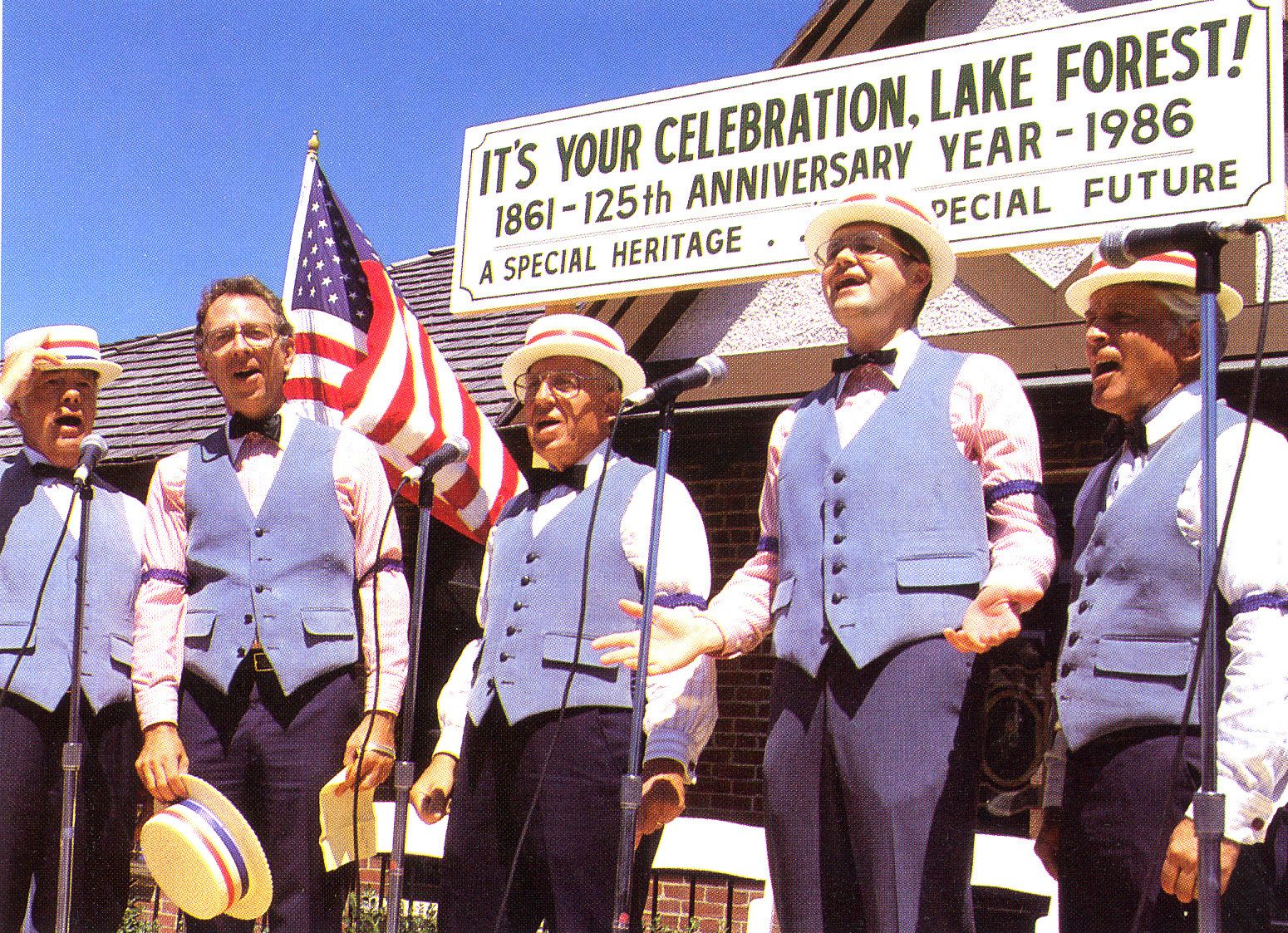 Harold Morrison (far right) singing at Lake Forest's 125th anniversary celebration in front of the East Lake Forest train station.