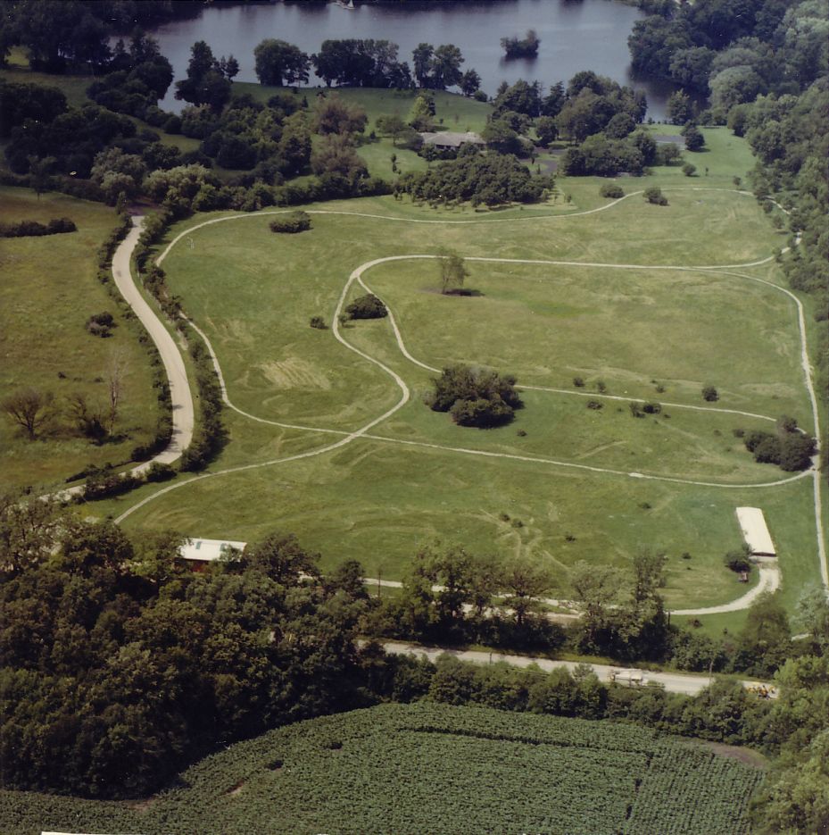 The aerial view shows the extent of the tracks on Donnelley's Mellody Road property, over a mile long. Route 60 is visible in the foreground.