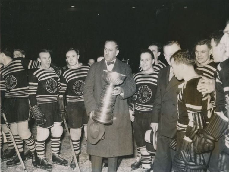 Chicago Blackhawks owner Frederic McLaughlin holding the Stanley Cup in 1934. He was said to be a very hands-on owner, going through coaches and tinkering with the roster at a prodigious rate.