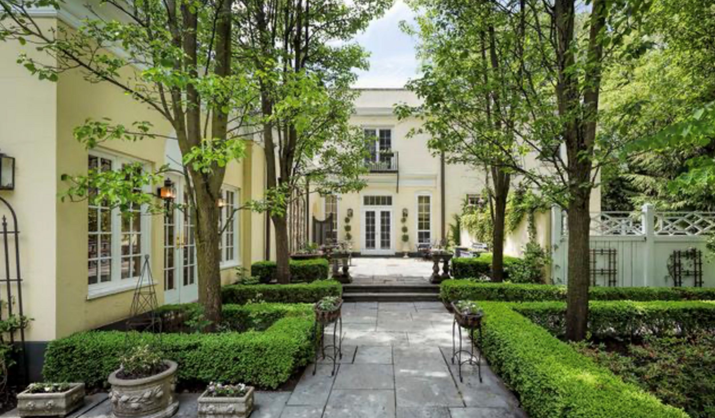 Back patio and gardens. Image courtesy Griffith, Grant and Lackie Realtors, c. 2017.