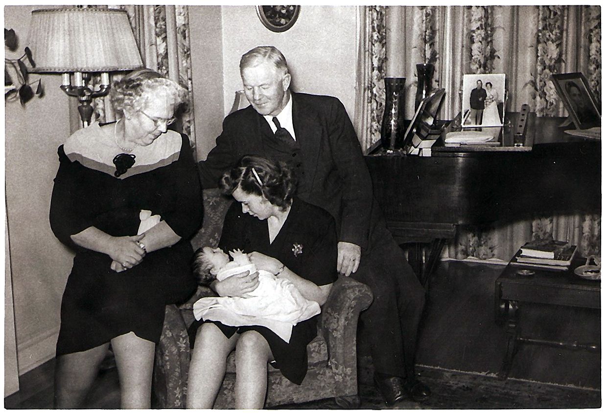 Neil and Helen Campbell visit 6 week old grand-daughter Chrissy Procter, in 1947.