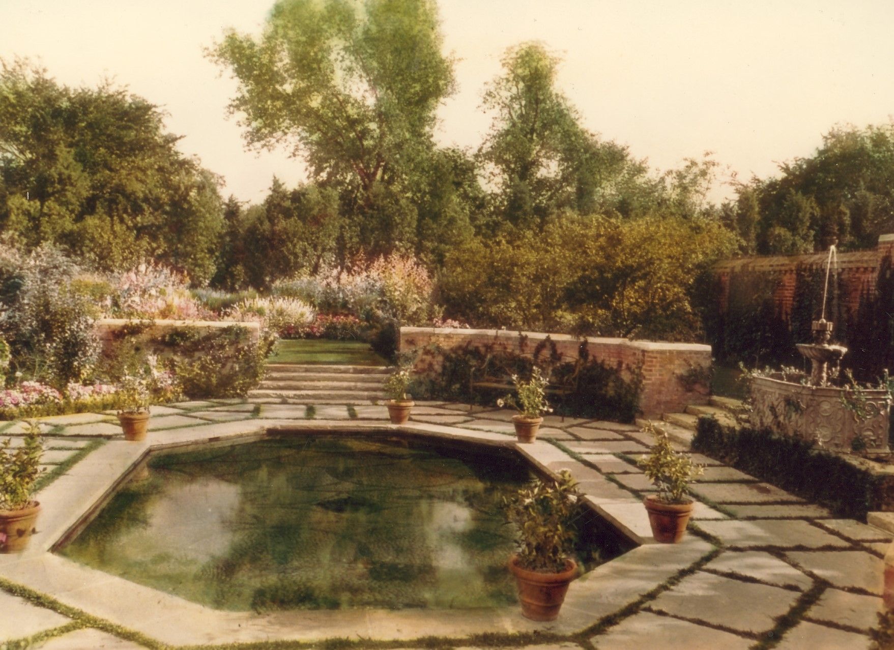 Octagonal pool with fountain.