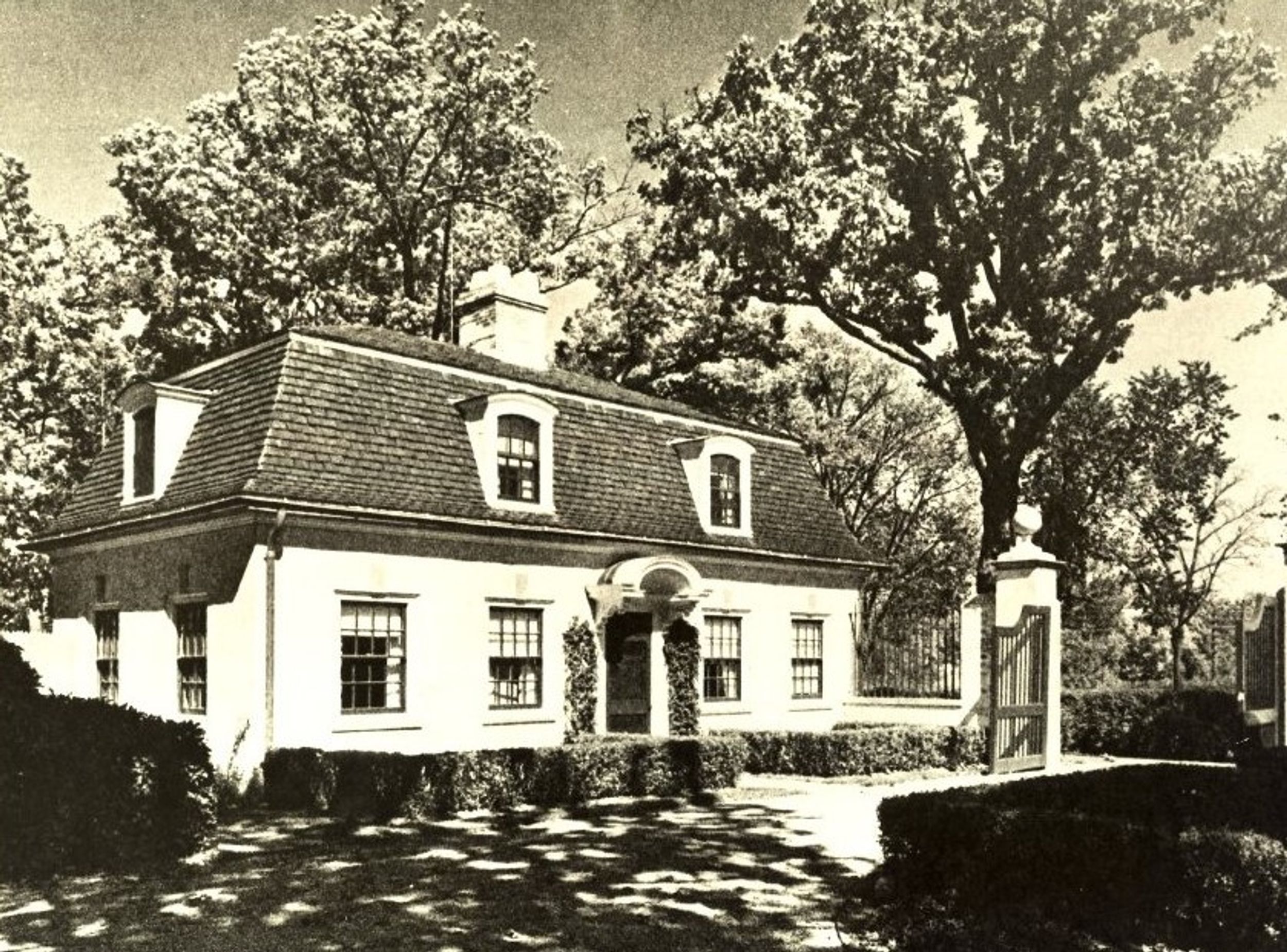 Gatehouse at 252 North Western Avenue. Plate 143 from David Adler by Richard Pratt, M. Evans and Co., 1970.