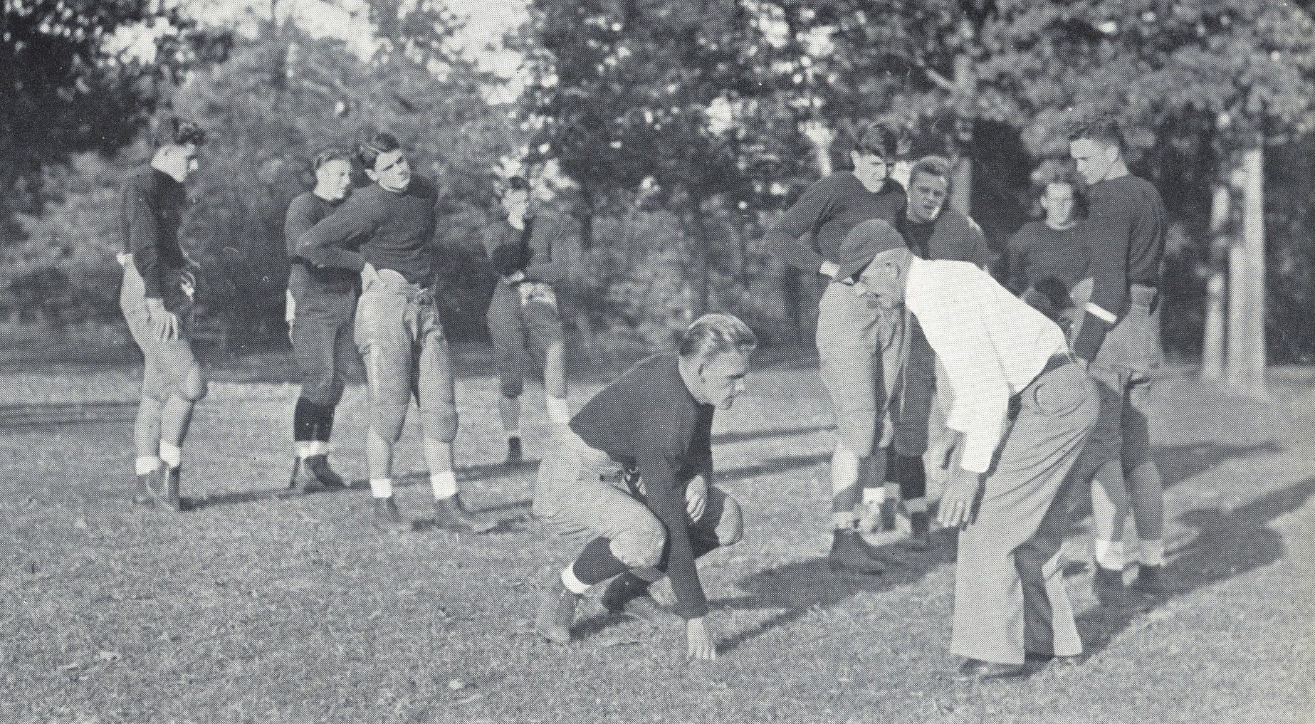 Coach Jones showing his Lake Forest College football team some techniques at practice, 1935. From the 1936 Forester yearbook.