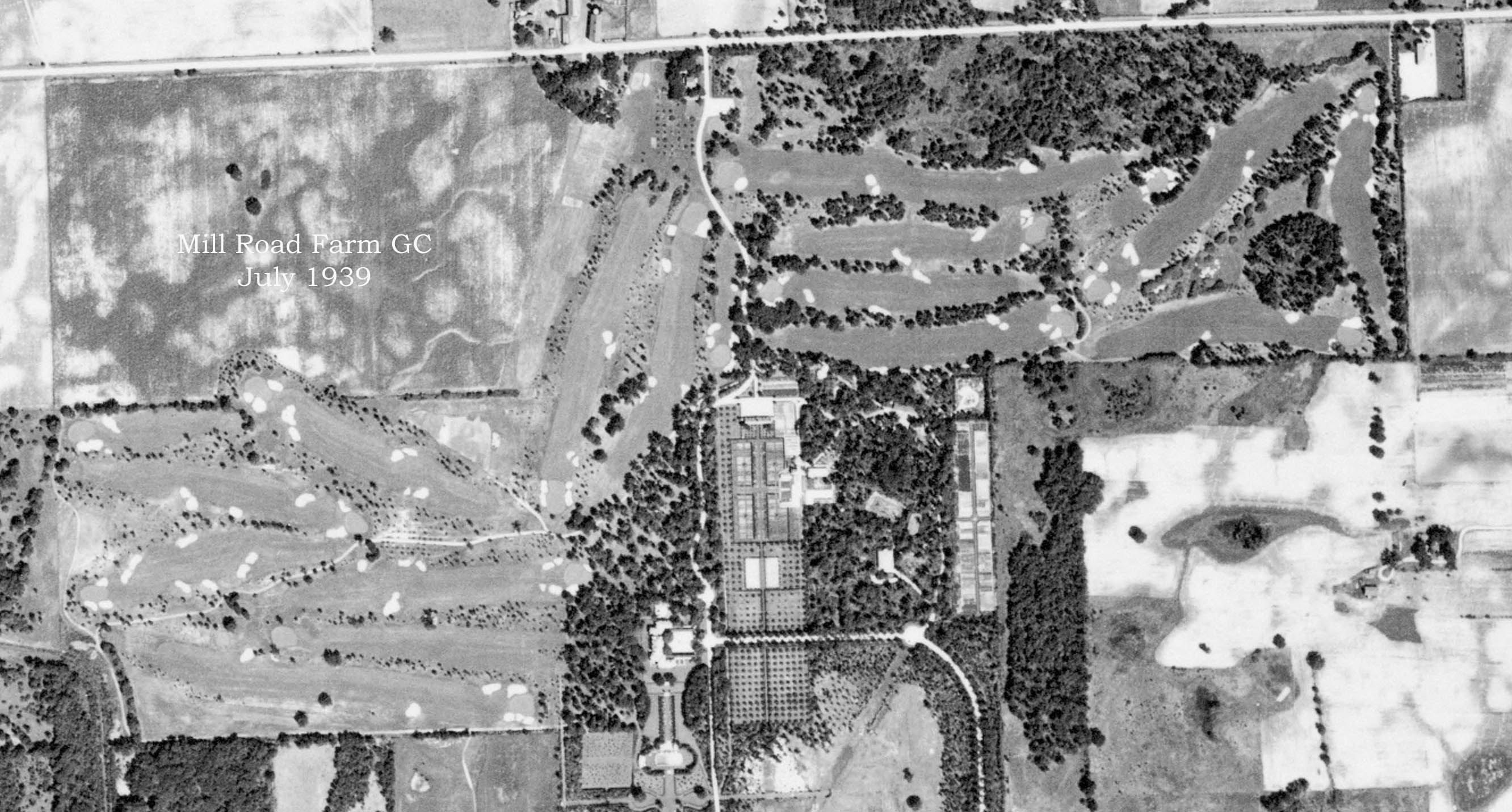 Aerial view of the Mill Road Farm golf course, surrounding the estate house, gardens and outbuildings at center, 1939. Everett Road runs horizontally through the top of the image, and Estate Lane meanders down through the middle. The north-south roads running vertically at left and at right are Riverwoods Road and Waukegan Road.
