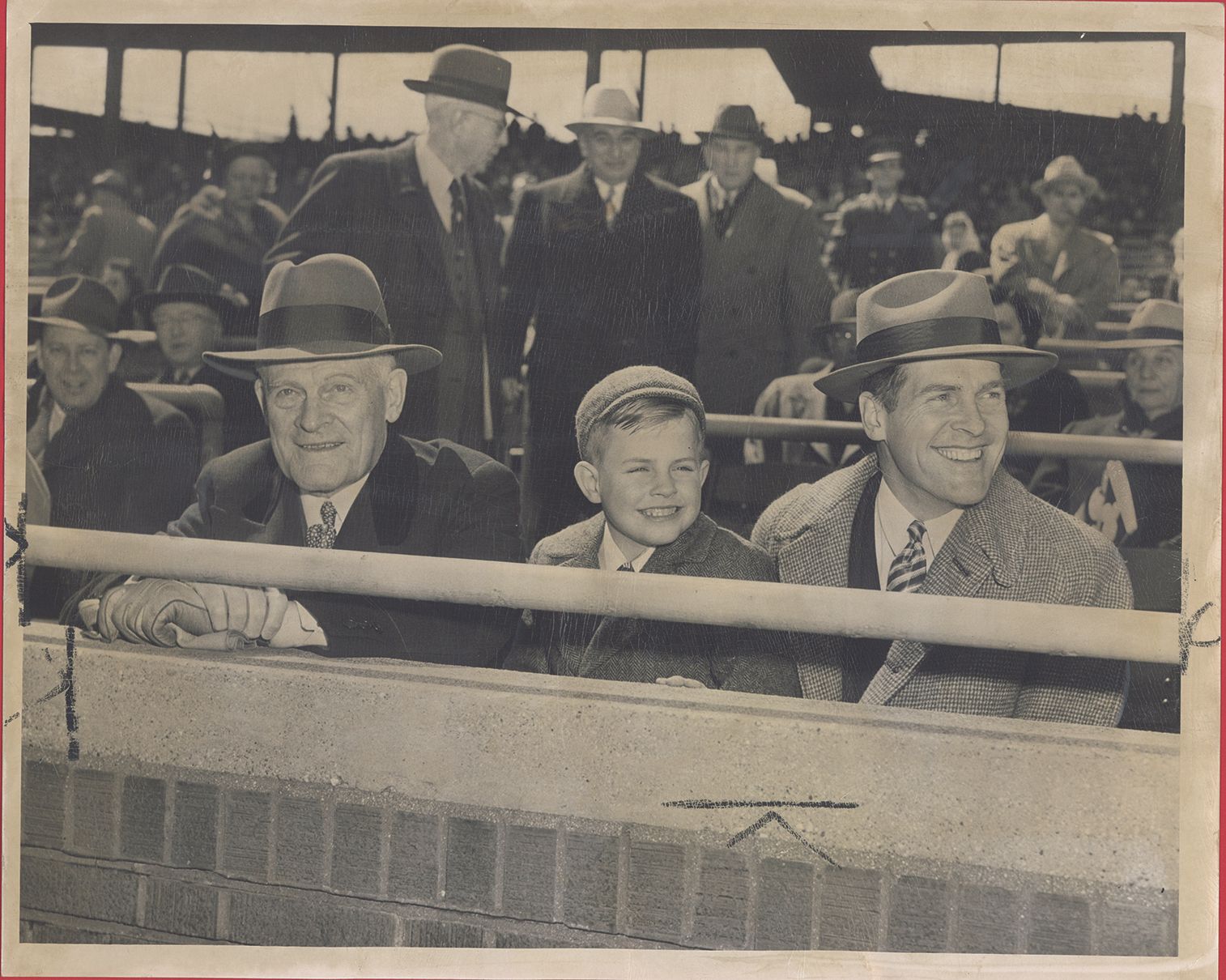 Thomas E. Wilson with son Edward F. and grandson Edward T. at Wrigley Field. April 20, 1949.