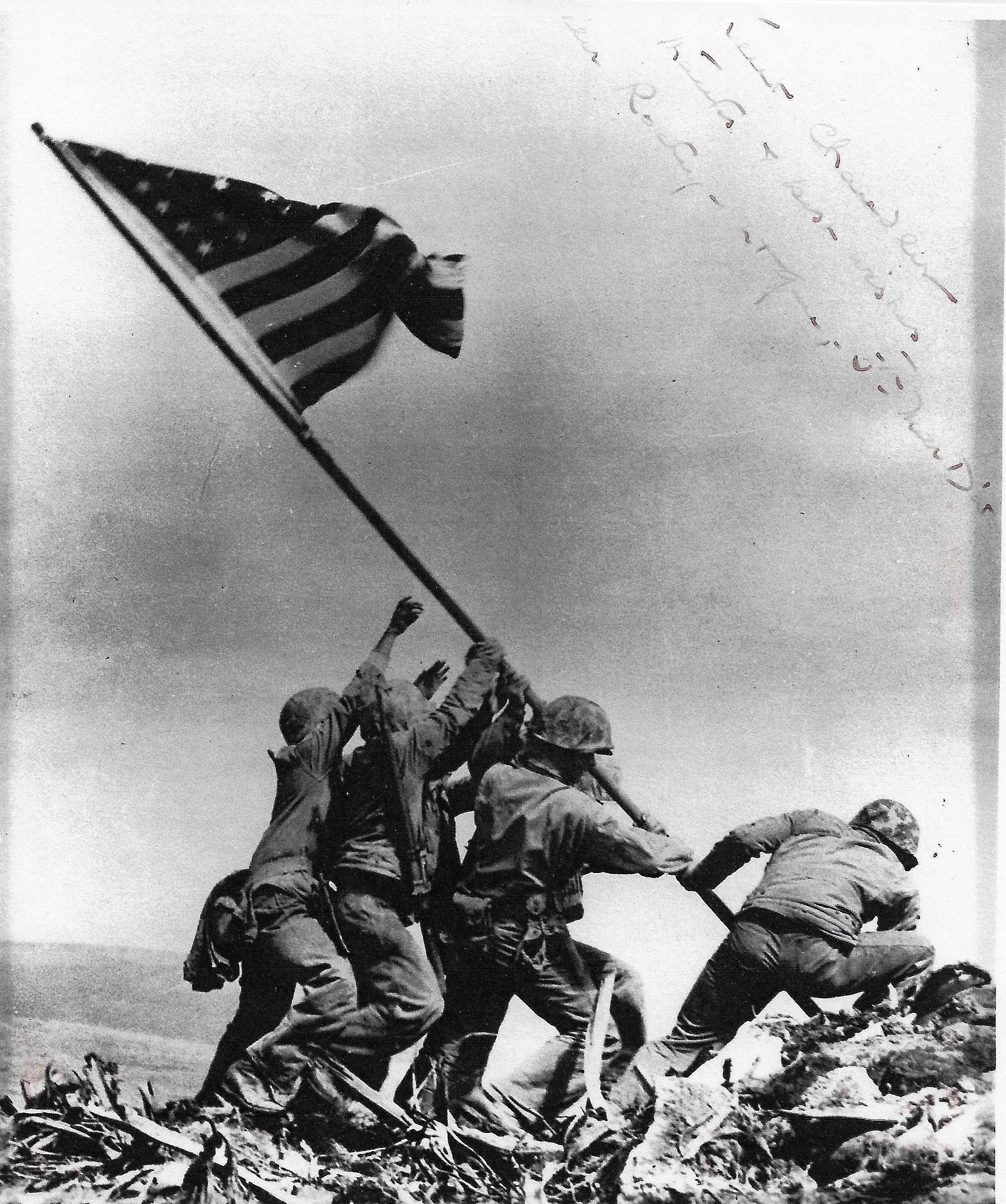 Iconic photo of the (second) flag raising at Iwo Jima, signed by the Major General of the Fifth Marine Division. Image source: Chandler family.