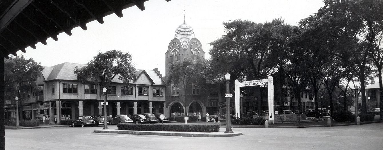 Looking southwest at Market Square from the train station, c. 1942. Note the War Loan Drive sign in the greensward.